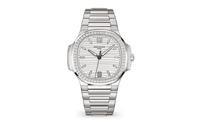 This particular watch is crafted in stainless steel and features a diamond-set bezel, adding a touch of luxury and elegance to its design.