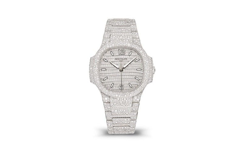 7118-1450G-001 is a Replica Nautilus Haute Joaillerie model presented by Replica Patek Philippe. This exceptional timepiece offers a new interpretation in white gold, and it is a stunning showcase of luxury and craftsmanship.
